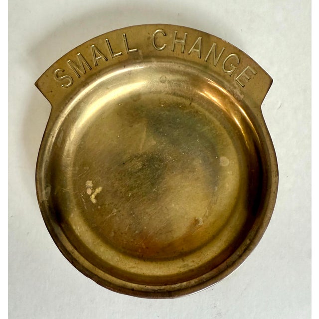 This sweet little brass catchall dates to the 1950s–1970s, and it’s stamped “SMALL CHANGE” right across the top. It was...