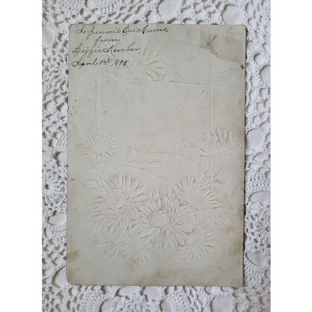 A late Victorian era embossed floral greeting card. Nautical in theme and hand tinted. It measures 8 ½” x 5 ¾” and would...