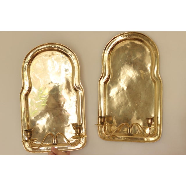 Stunning pair of Mid century Swedish brass sconces, featuring beautiful detailing. Both sconces are in very good vintage...
