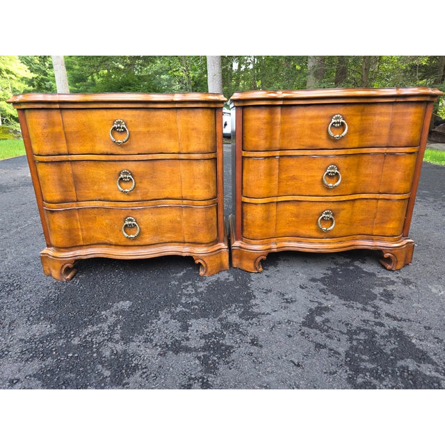 Pair of Century Furniture Company 3 drawer nightstands. Design is traditional French style with elegant serpentine...