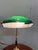 Refined Churchill table lamp from the early 1900s, made of brass with a green opaline glass shade (white inside). An...