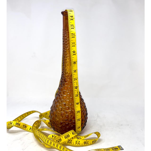 Add a glow of Mid-Century Italian sophistication to your shelving or tablescape with this stunning Empoli amber glass...