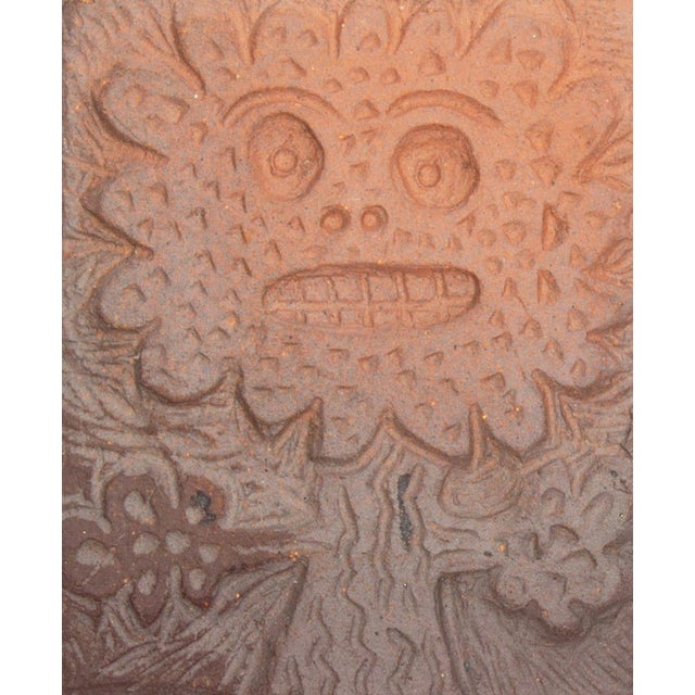 A studio pottery tile by the American artist Mark Bulwinkle (born 1946). This tile depicts the impressed image of a...