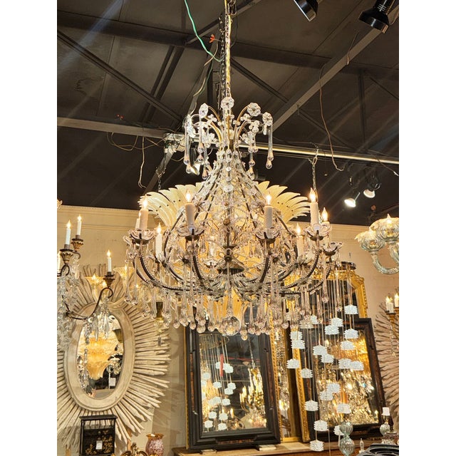 The 19th c. French Beaded Crystal Basket Chandelier is a stunning and elegant piece of antique lighting that adds a touch...