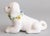 A charming petite vintage Italian white majolica dog figurine with a lovely flower wreath around its neck, circa 1950....