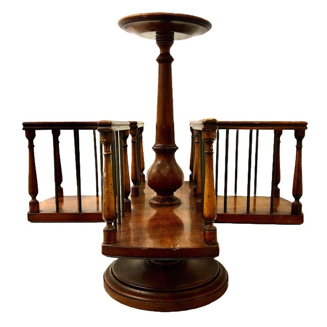 This striking piece is a mid-20th-century tabletop revolving book rack, meticulously crafted by the renowned American...