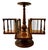 This striking piece is a mid-20th-century tabletop revolving book rack, meticulously crafted by the renowned American...