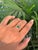 This cluster ring is featuring a 0.84 carats oval cut emerald set in 14K yellow gold. The emerald measuring approximately...