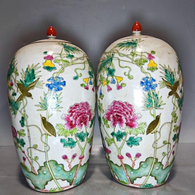 Bring a vibrant touch of classic Chinoiserie to your home with this beautiful pair of vintage Famille Rose lidded jars....