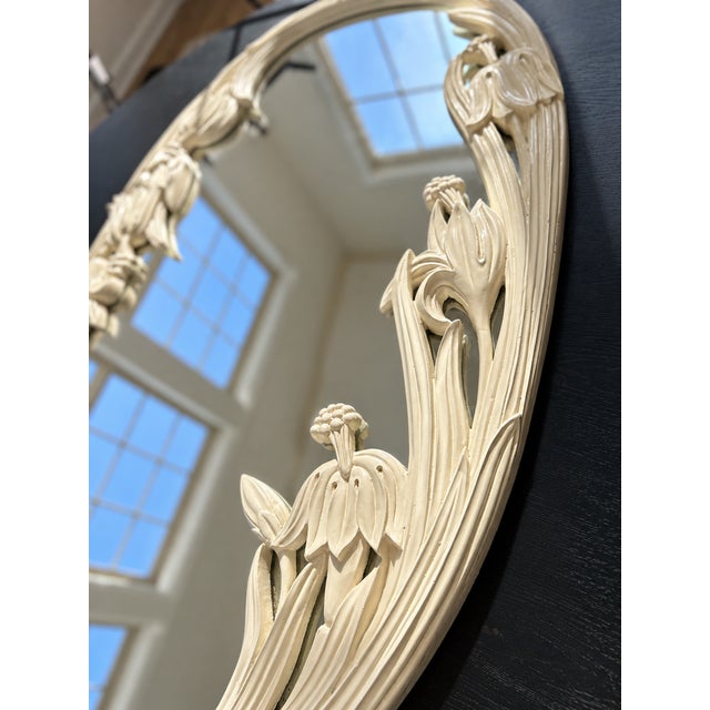1950s hand carved, oval shaped, floral mirror.