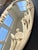 1950s hand carved, oval shaped, floral mirror.