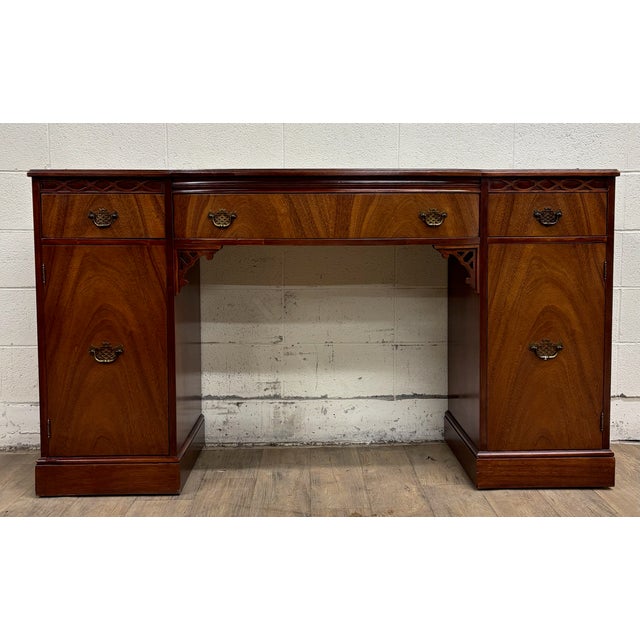 This is a gorgeous vintage Chippendale style galleried mahogany sideboard, buffet, console, or writing desk. Features a...