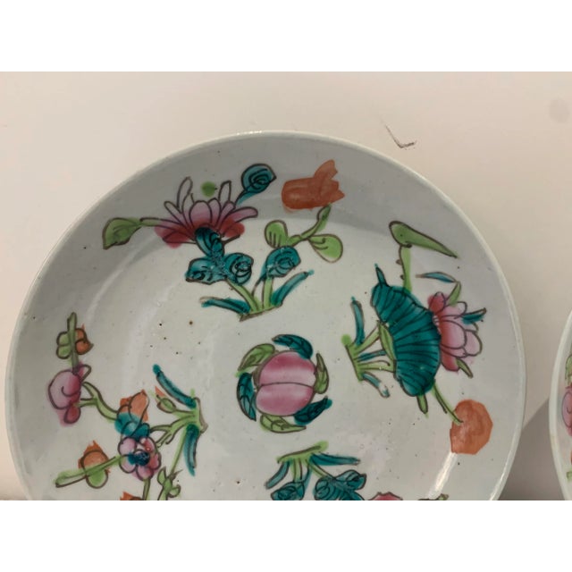 Pair of beautiful antique Famille Rose Chinese plates decorated with hand painted polychrome enamel peach fruit also with...