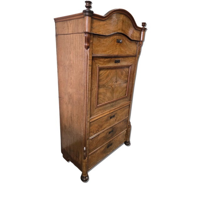 A handsome 19th century Central European Biedermeier secretary cabinet crafted in richly figured walnut veneer. The piece...
