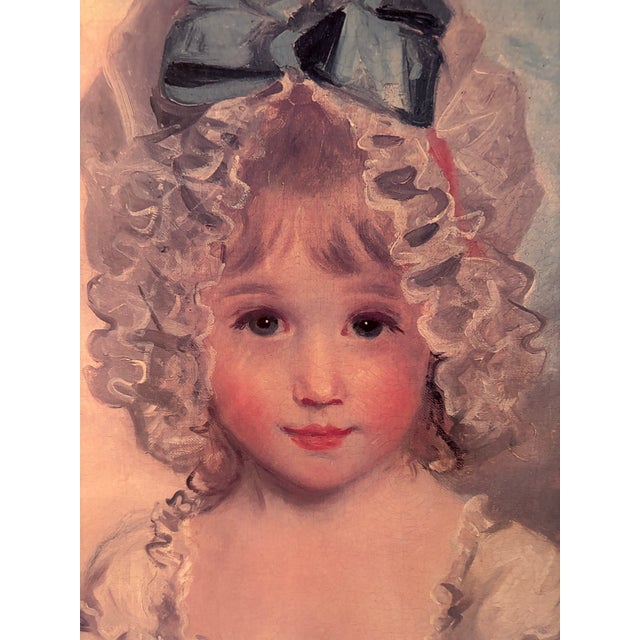 Large framed lithograph of pretty blond girl in blue bonnet and sash.