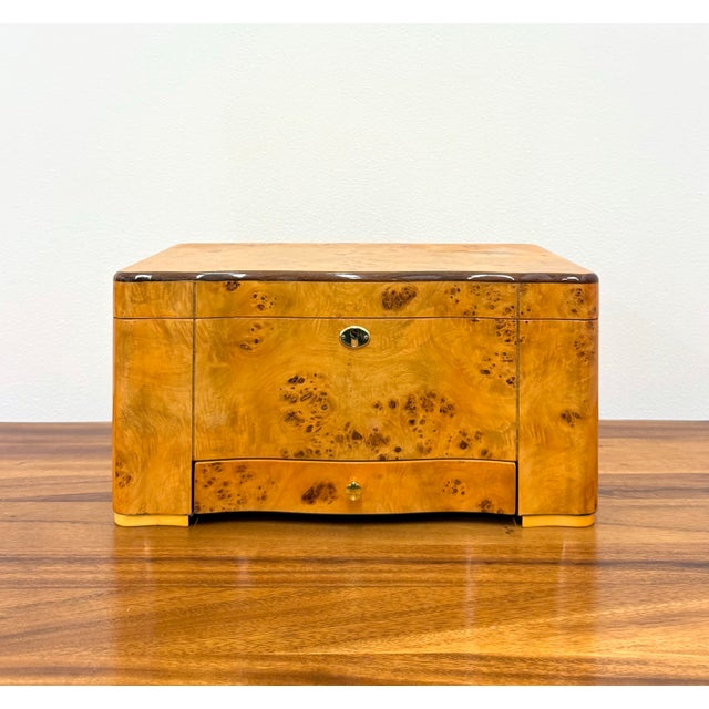 A handsome vintage cigar humidor by Thompson & Co., crafted with richly figured burl wood in a warm honey finish. The case...