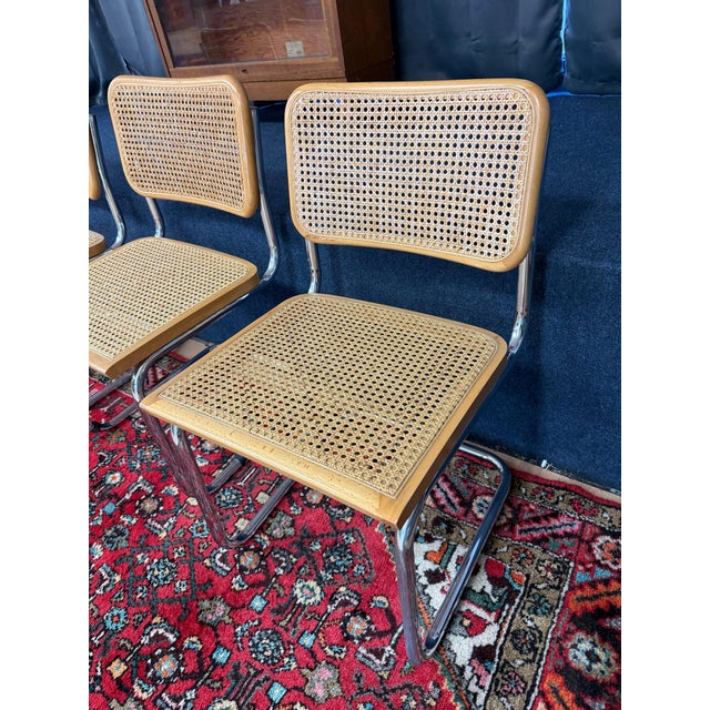 Authentic Mid-Century Italian Cesca Cantilever Chairs Attributed to Marcel Breuer Elevate your dining space with this...