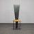 An expressive postmodern chair that blurs the line between furniture and sculpture. The dramatically elongated backrest...