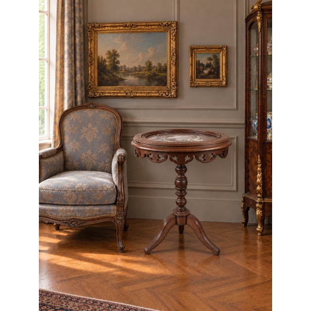 French guéridon side table from the late 19th century (circa 1880–1900), featuring a circular marble top set within a...