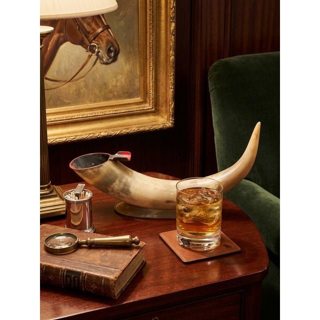 Elevate your study, bar cart, or library with this striking vintage tabletop horn ashtray. Crafted from a genuine,...