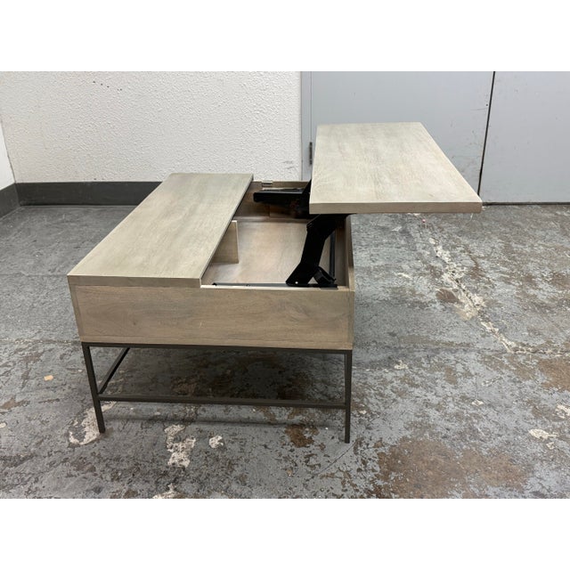 Design Plus Gallery presents the Industrial Storage Pop-Up Coffee Table by William Sonoma for West Elm. This wood coffee...