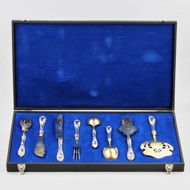 7-piece silver serving set, including: knives for meat and fish, forks for meat and seafood, spoons for sauces, and scoops...