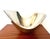 A stunning fruit bowl attributed to Michael Lax, dating from the 1980s, with a sculptural and airy design that perfectly...