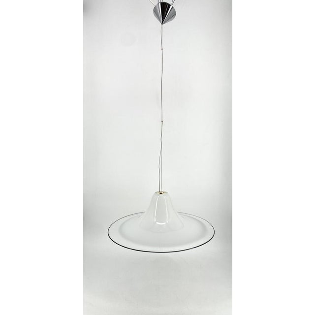 a ceiling lamp *by Renato Toso *for Leucos *Italy *1970s *made of Murano glass *Chrome-plated canopy *cone-shaped...