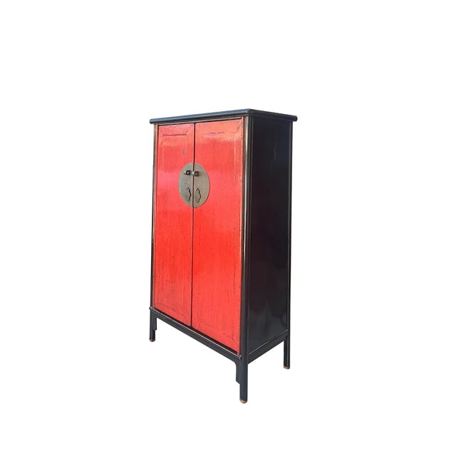 This distinctive storage cabinet blends traditional Chinese design with modern rustic charm. The cabinet features a...
