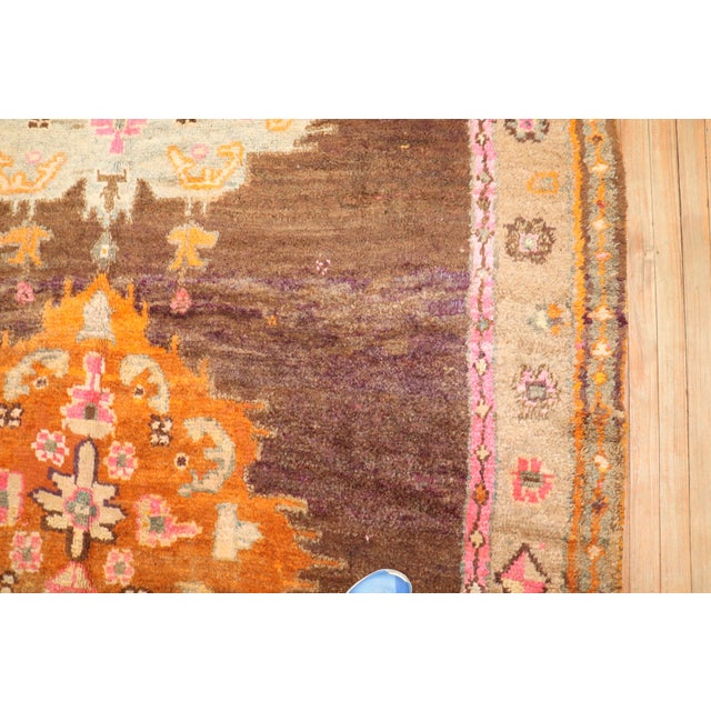 3rd quarter of the 20th Century Turkish Kars rug with 2 floral medallions on a brown color ground Measures: 7' x 9'4''