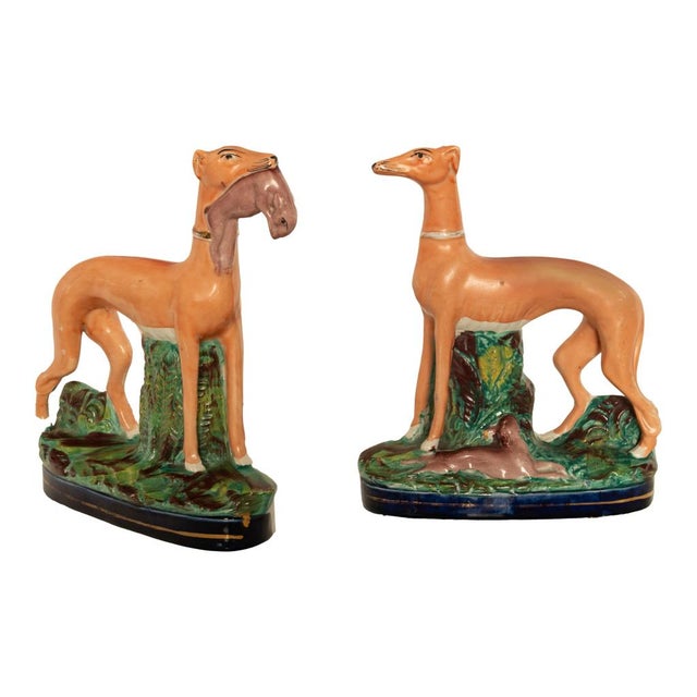 An attractive and large pair of antique 19th century Staffordshire pottery whippets or greyhounds, circa 1860. This very...