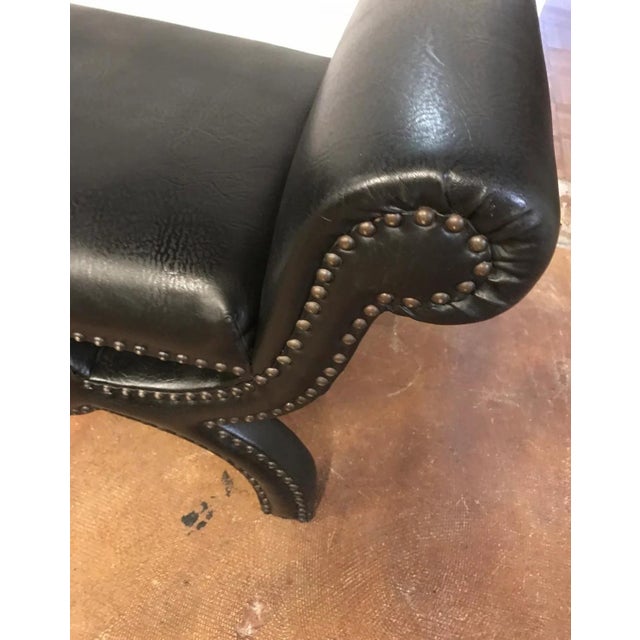 This ottoman/stool is a unique and stylish piece that is sure to add character and flair to any room. The vintage vinyl...