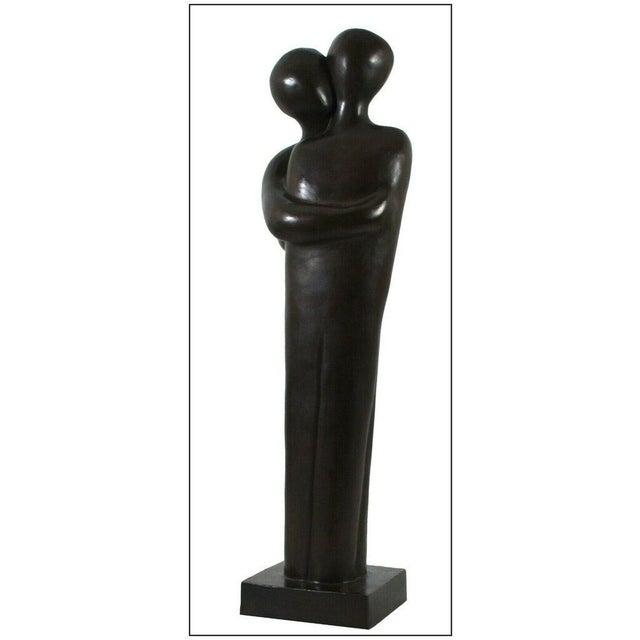 Noemi Schindler Sculpture titled, "Embrace Original" that is one of her most famous and iconic creations. This piece,...