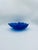 A large vintage-style serving bowl made of high-quality glass. The bowl, in a deep cobalt blue, is distinguished by its...