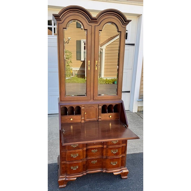 Nice cherry Blockfront secretary desk with double dome top bookcase on top. There is a light behind each door on the upper...