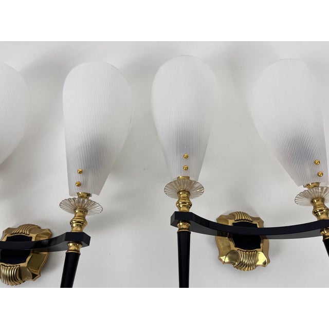 Maison Arlus sconces made in France in the 1960s. The body is made of plastic with beautiful brass ornaments. The shades...