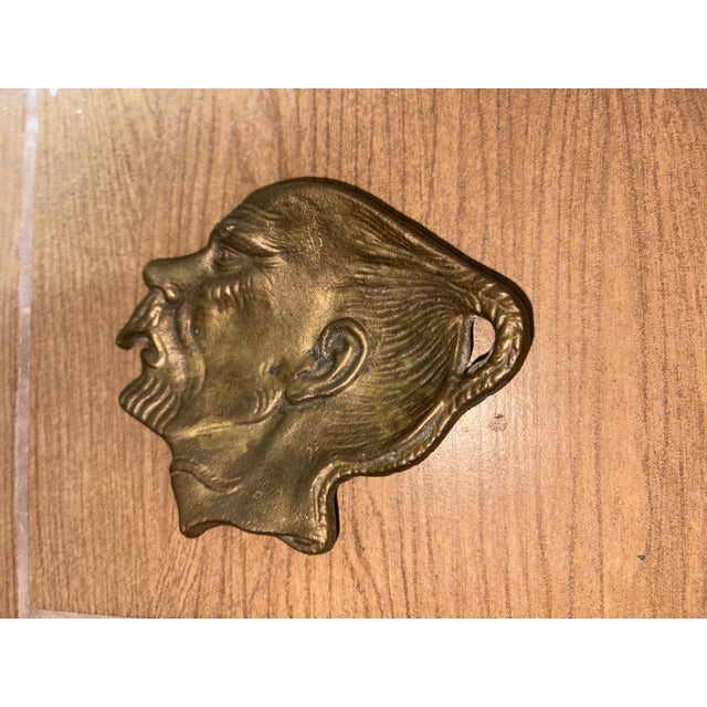 Vintage brass or bronze ashtray or coin tray depicting a male face in profile with a knocker, height 11 cm, height 13 cm,...