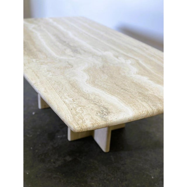 137cm long, 76cm wide, 45cm high Vintage rectangular travertine marble coffee table from the 1980s. The table has warm...