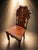 A highly decorative antique solid oak hall chair, dating to the late Victorian period, circa 1880–1900, and displaying...
