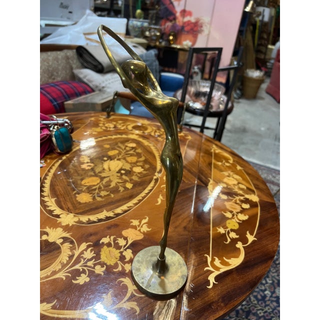 Beautiful sculptural brass ballerina. Perfect for a nursery or library. perfect for the interior designer. Check out my...