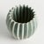 With a rounded form, deep ribbing and thickly applied glaze, this natureinspired pot is a work of art. The handfinished...