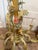 A whimsical and truly special piece of Italian lighting — this mid-century tole chandelier centers on a playful monkey...