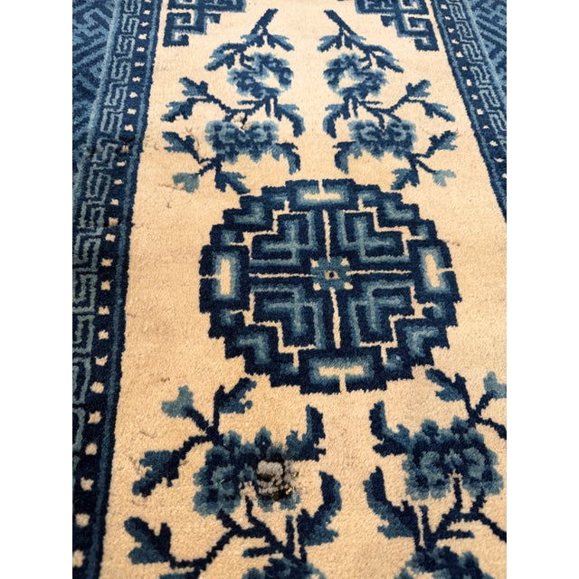 Hand-Knotted Chinese Art Deco Wool Rug, circa 1920s-1930s - 1'11" x 3'5" (23 in x 41 in). Ivory field with blue floral...