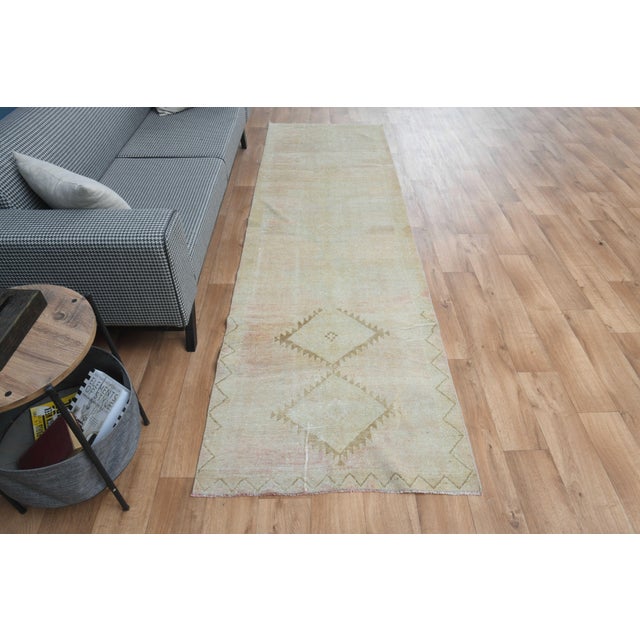 This vintage hand-knotted area rug is a semi-antique vintage area rug. The '70s Eastern region of Anatolian's unique rug...