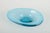 Scandinavian glassworks Art glass bowl, 1970s. Organically shaped, mouth-blown bowl in turquoise blue glass with thick...