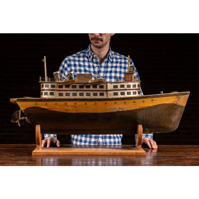 Large handmade pond boat model constructed in wood and tinplate, modeled after an early passenger steamer or riverboat...