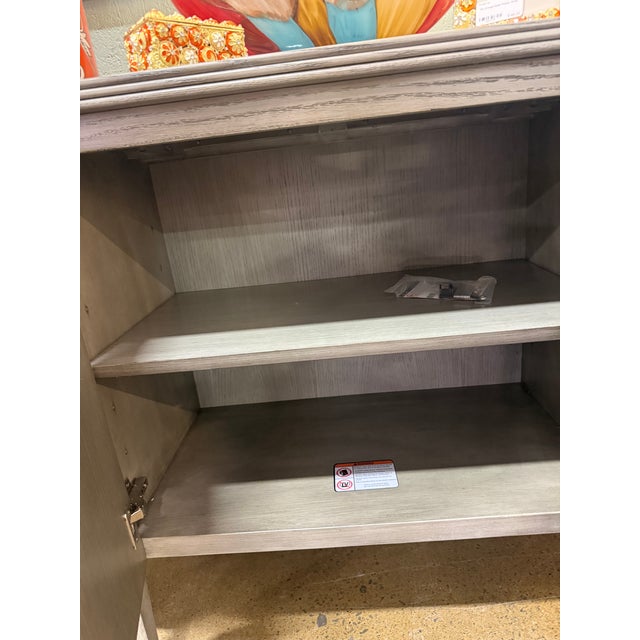 This demi-lune cabinet would be a beautiful and elegant piece to elevate your space! The front doors and side doors open...