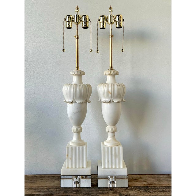 This exquisite pair of vintage table lamps represents the height of Neoclassical sophistication and Hollywood Regency...