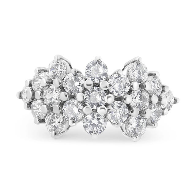 Elevate your style with the captivating allure of this stunning ring, expertly fashioned in 14K white gold. The...