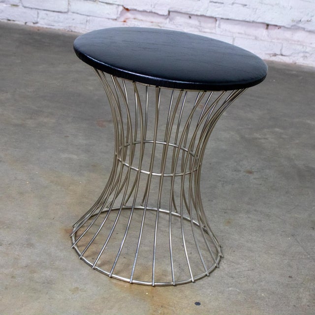 Handsome vintage MCM or Mid-Century Modern stool in the manner of Warren Platner composed of a chrome wire rod waisted...
